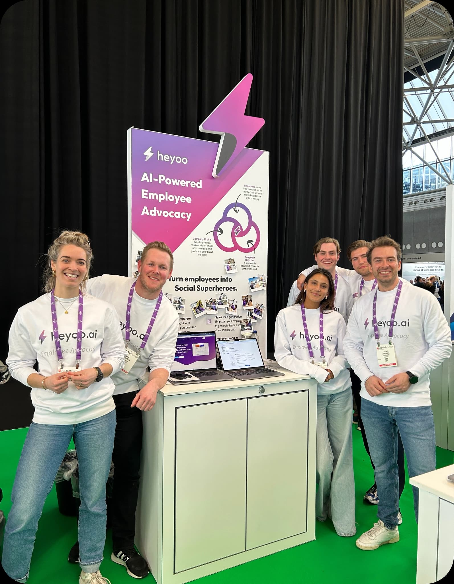 The Heyoo team at a conference booth